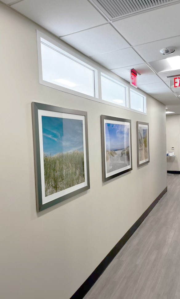 Innerscene Circadian Sky 2x4 artificial skylight units installed in wall of hallway in Leon Medical Hospital, Miami