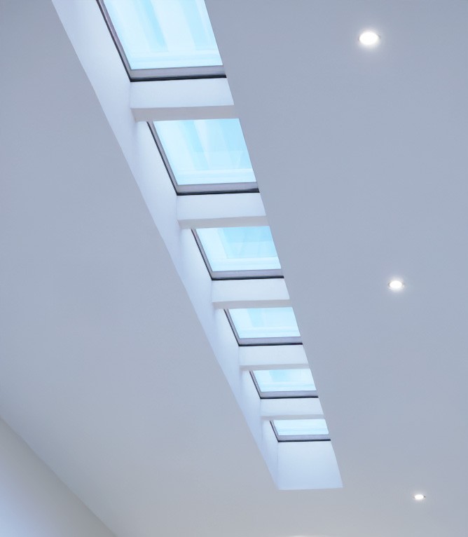 Innerscene Circadian Sky artificial daylight light fixtures installed in long row on ceiling mimicking natural blue sky